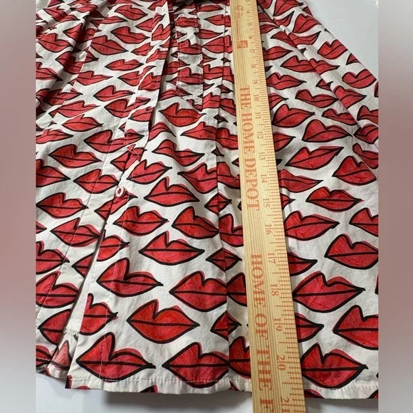 Anthropologie Red Smooch Dress. All Over Red Lip Design. Button Front. Pockets. - Picture 15 of 16